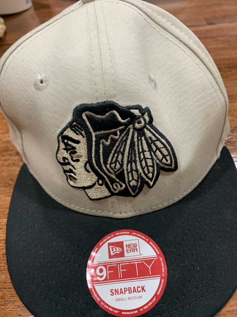 New Era Two-Tone Snapback Cap in Cream & Black with Embroidered Logo